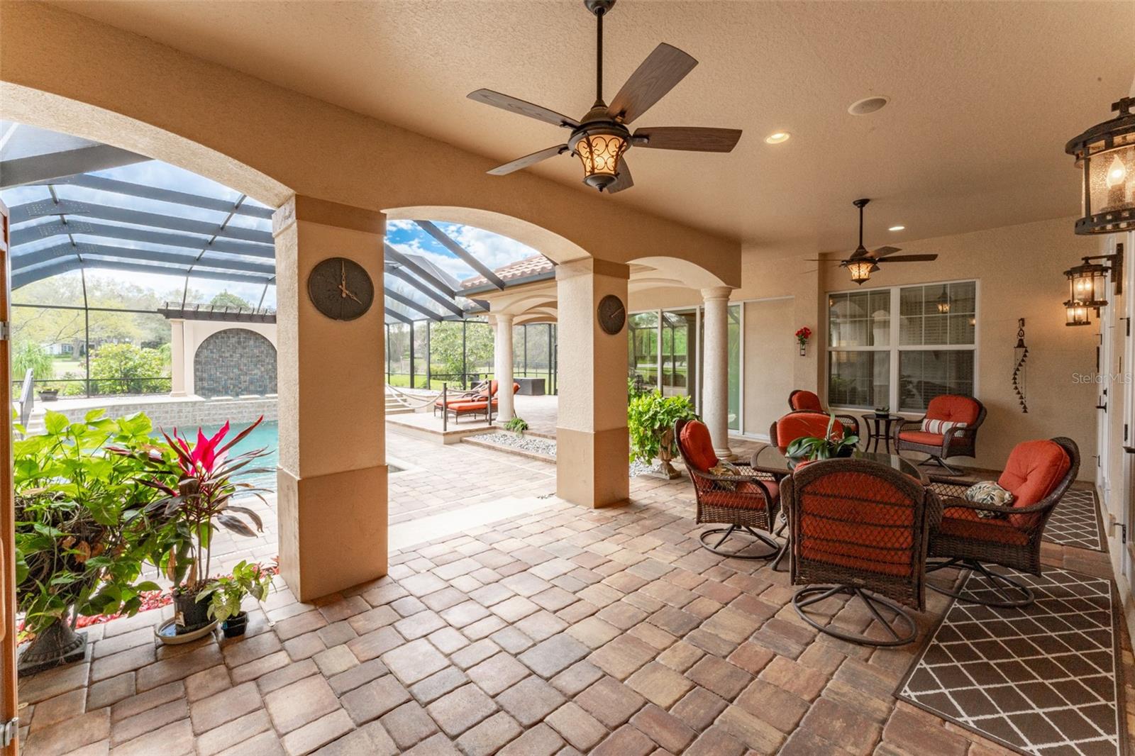 Delightful Outdoor Living Space with Two Covered Areas & Brick Paved Flooring