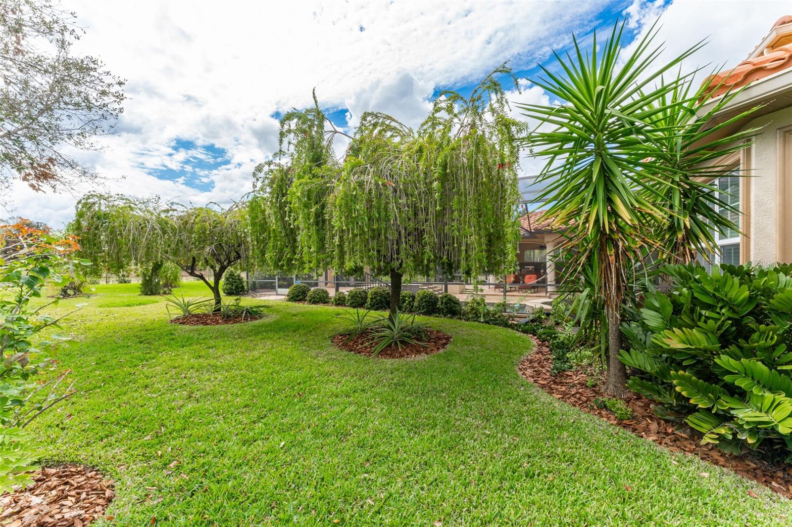 Private Backyard with Lush Landscaping Backing to Conservation Pond