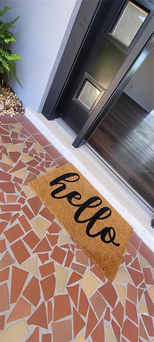Lovely Mid-Century home with some updates and accents of vintage items... mosaic tile entry