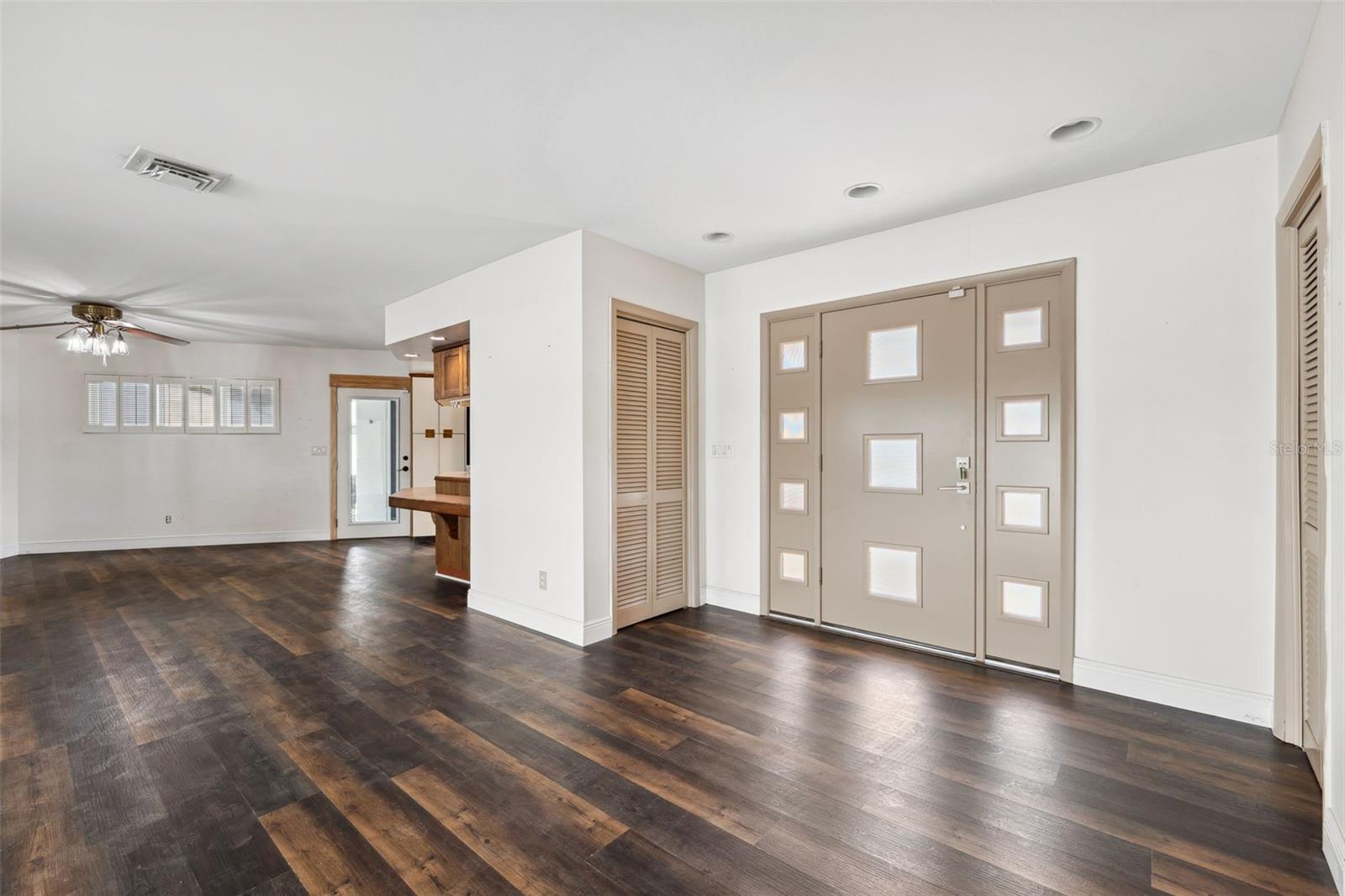 Modern entry door with a Mid-Century feel... enters into a open floorplan