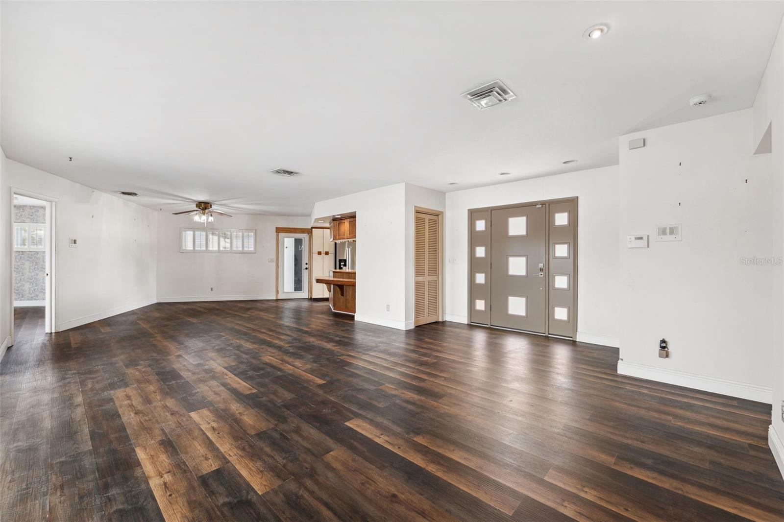 Modern entry door with a Mid-Century feel... enters into a open floorplan