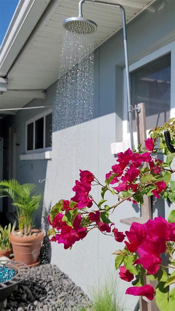 Rear side patio and fenced in petite yard