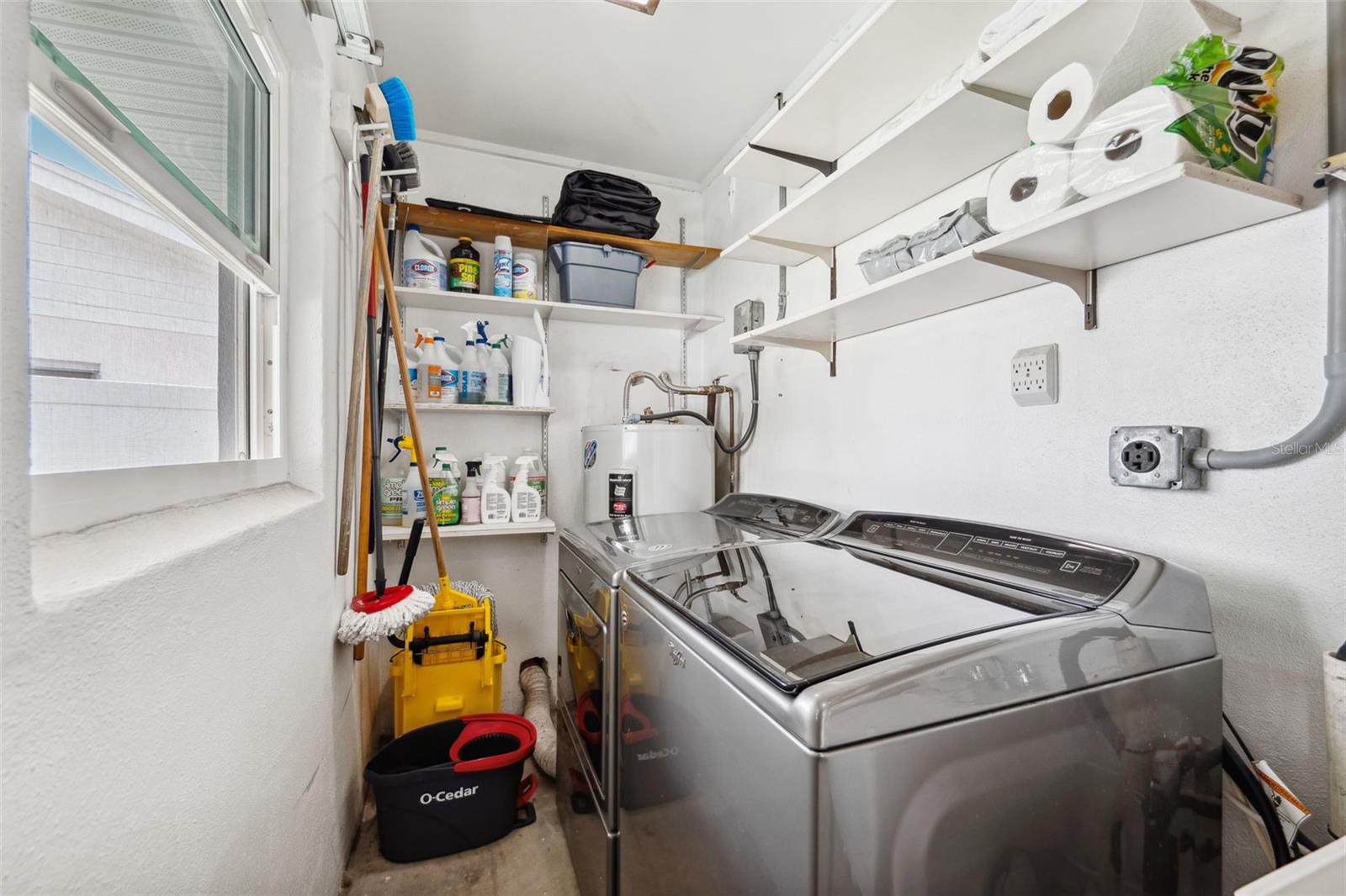 Laundry room just steps from the kitchen garage, and side patio
