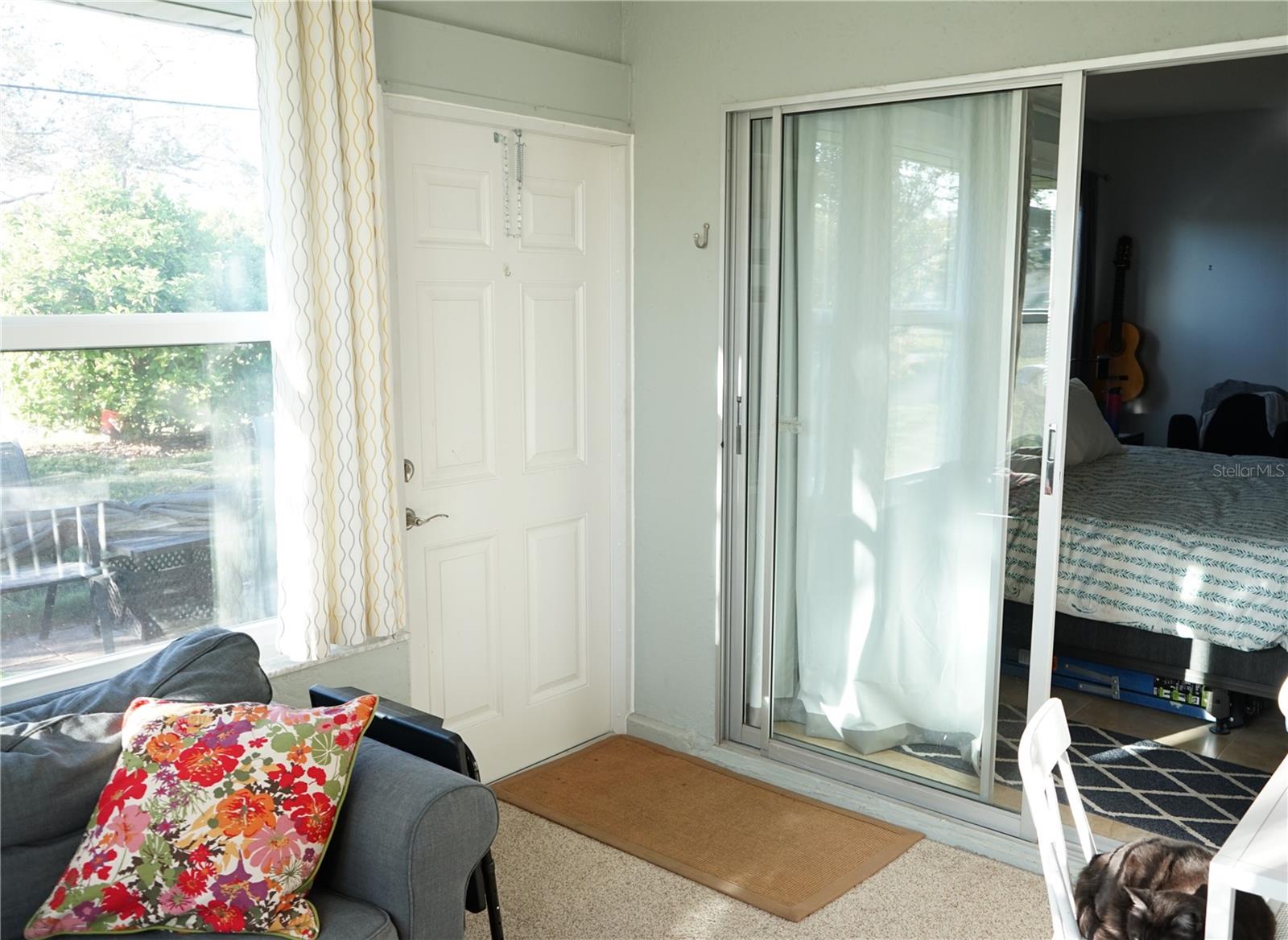 lanai has door to back patio and primary bedroom