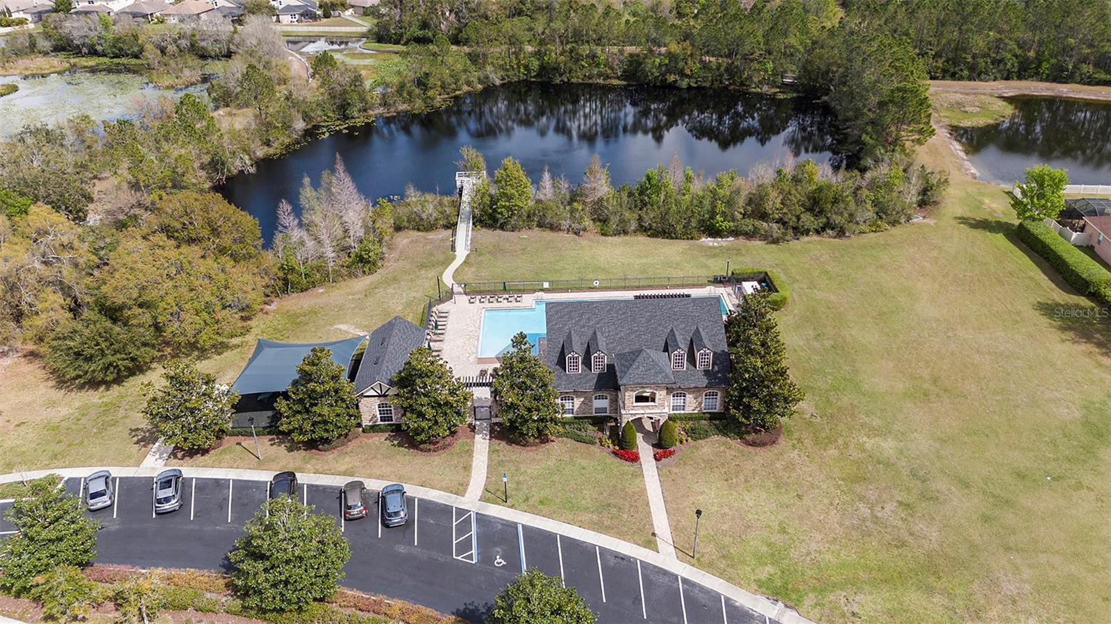 Fishing dock, green space, pool and playground