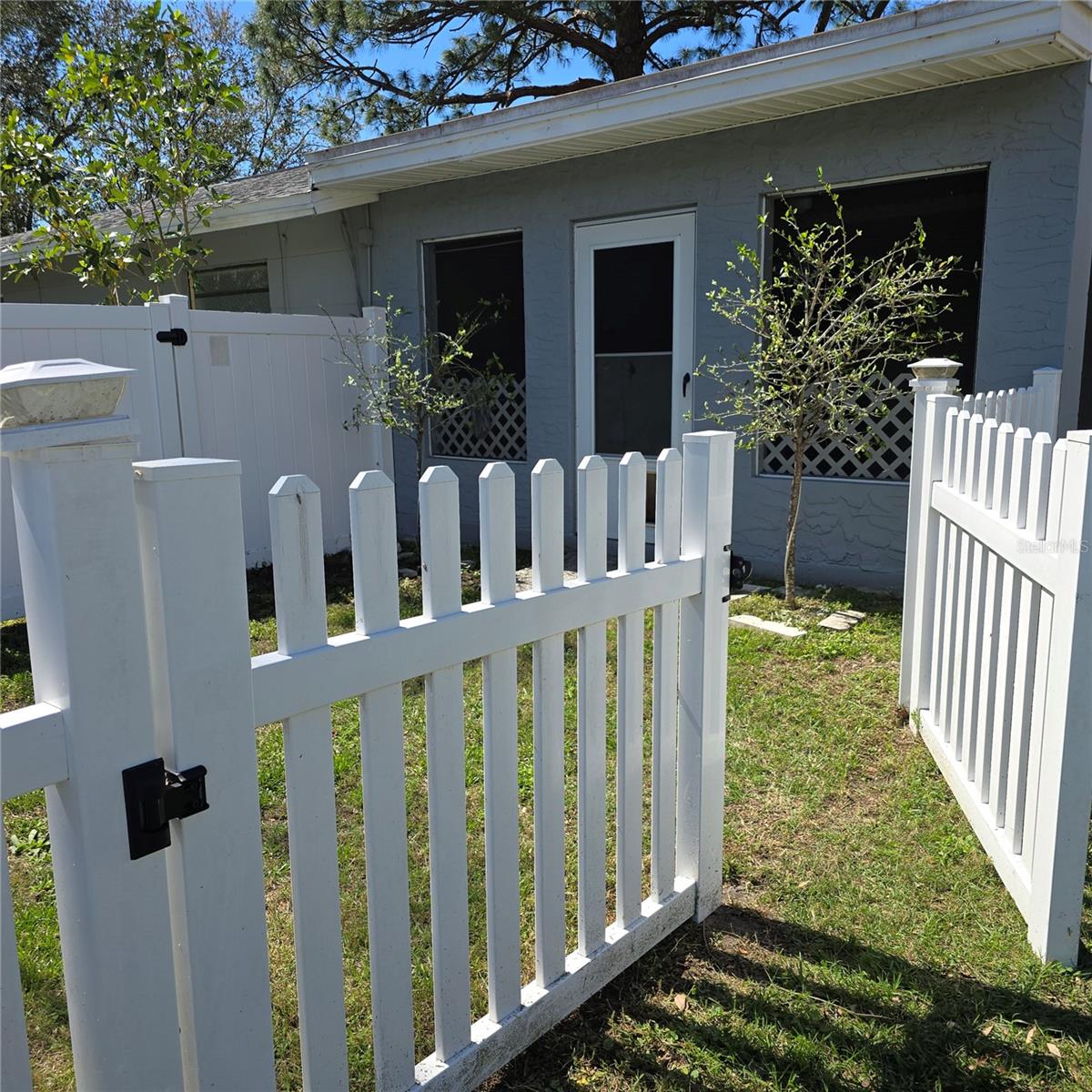 Fenced in side courtyard for your furry friends complete with pet door access!