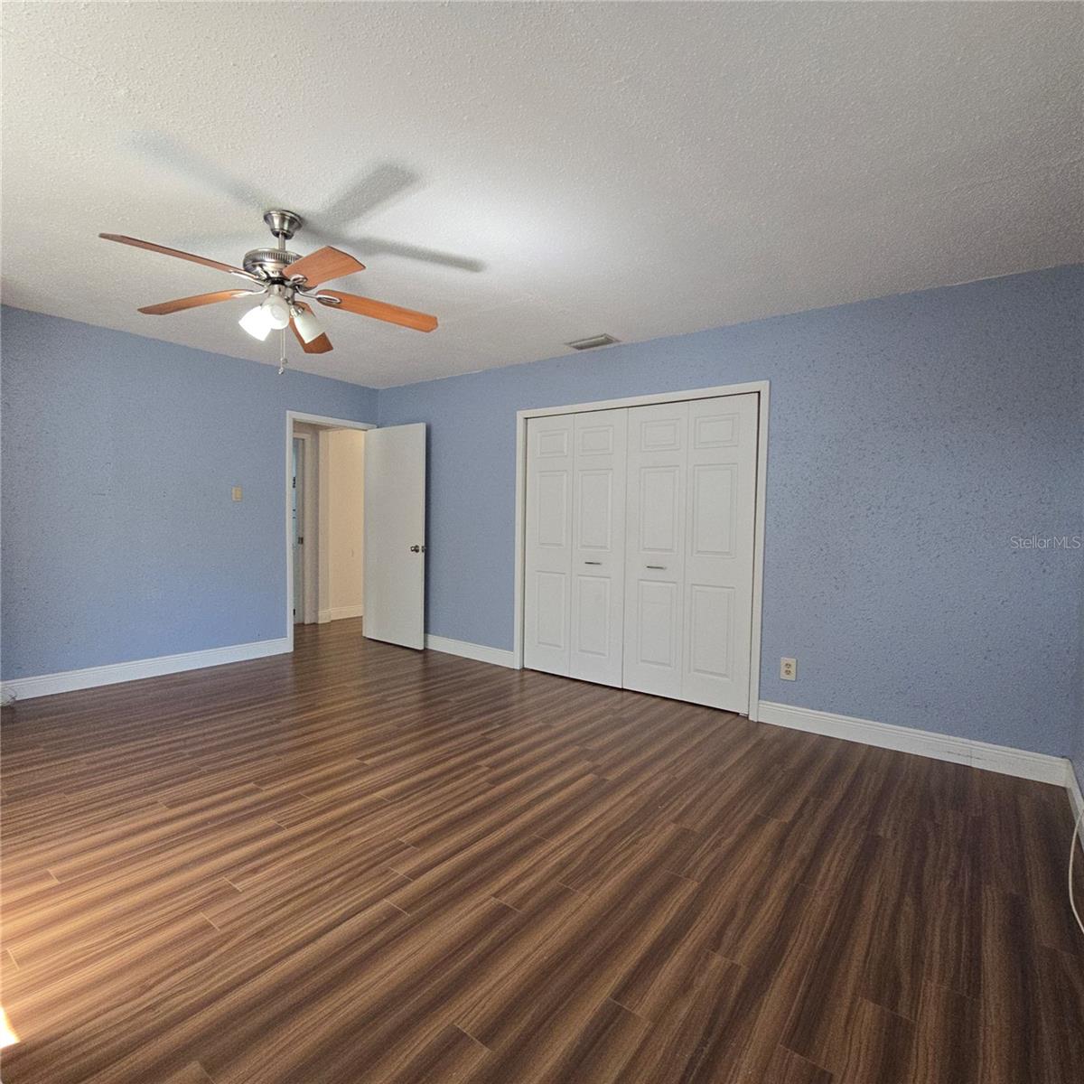 Extra large primary bedroom view towards hall