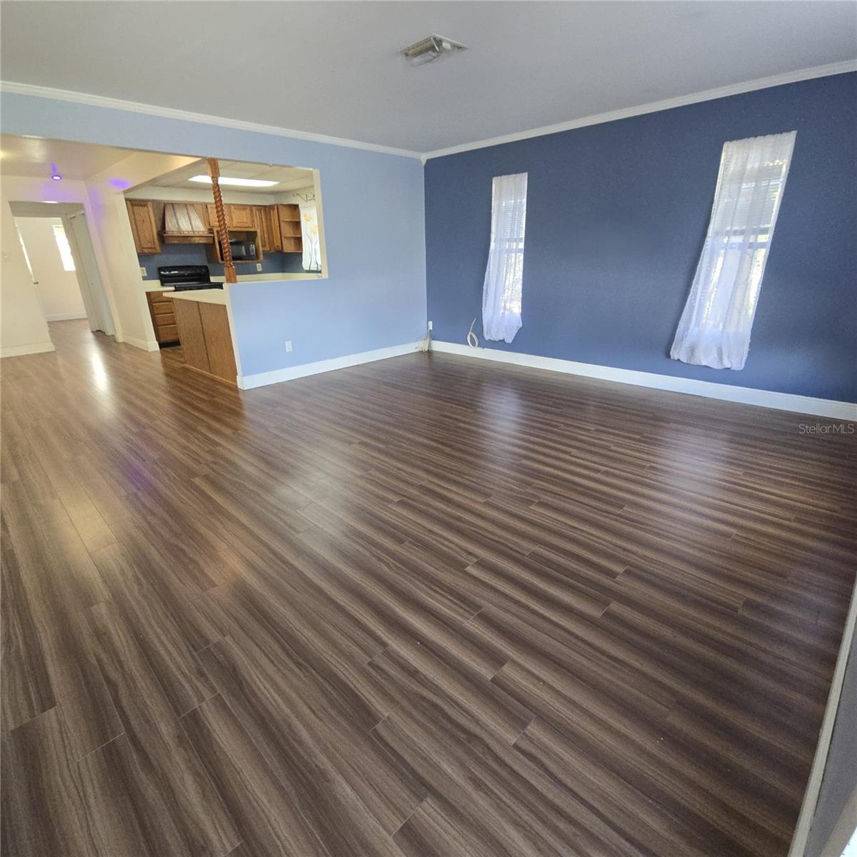 View from front door of living room towards kitchen and dining area