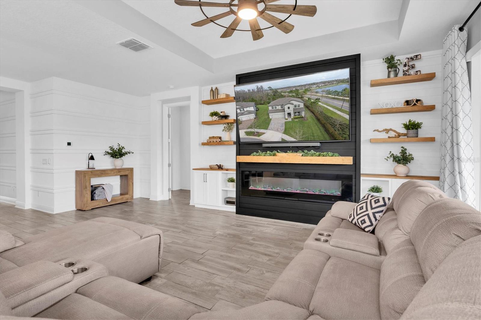 LIVING ROOM WITH COZY FIREPLACE