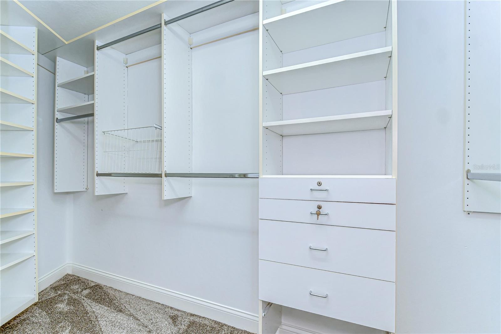 Experience the luxury of organization in this spacious closet.