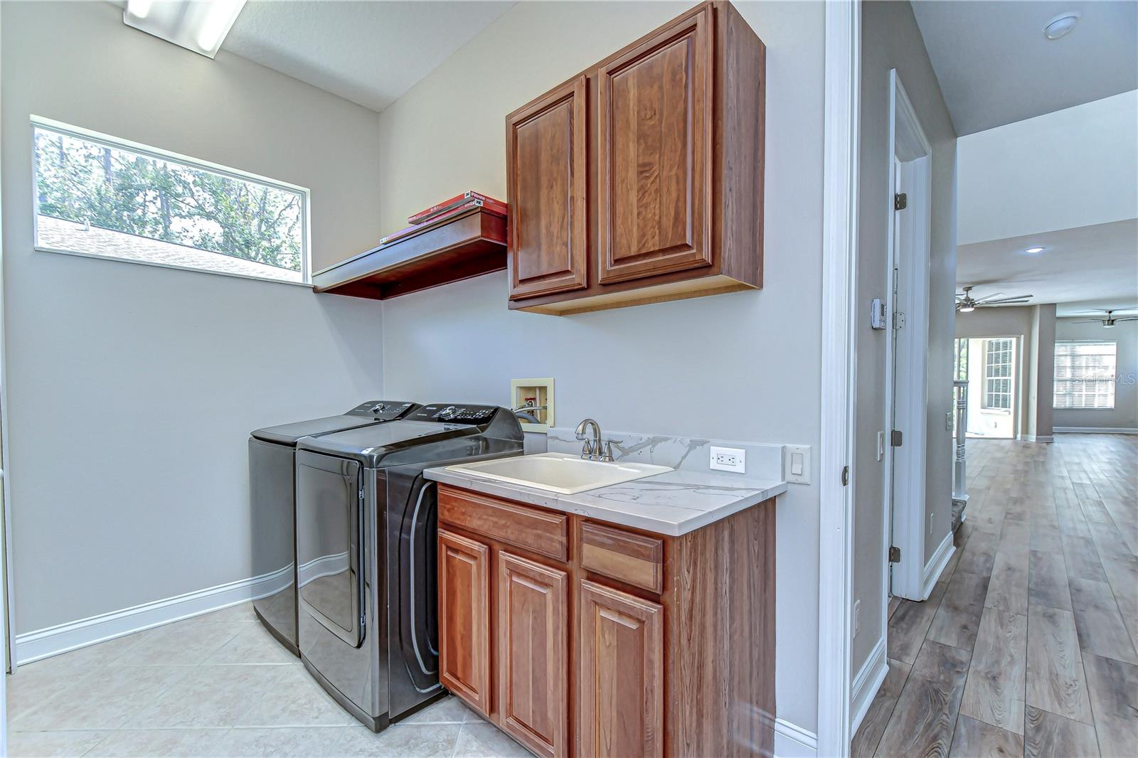 Discover the convenience of this sleek laundry space