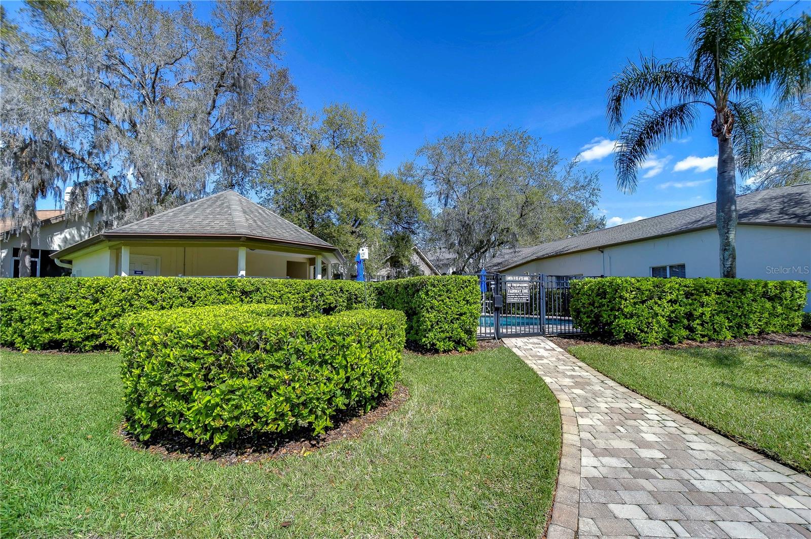 Beautiful landscaping guides your path to the community pool!