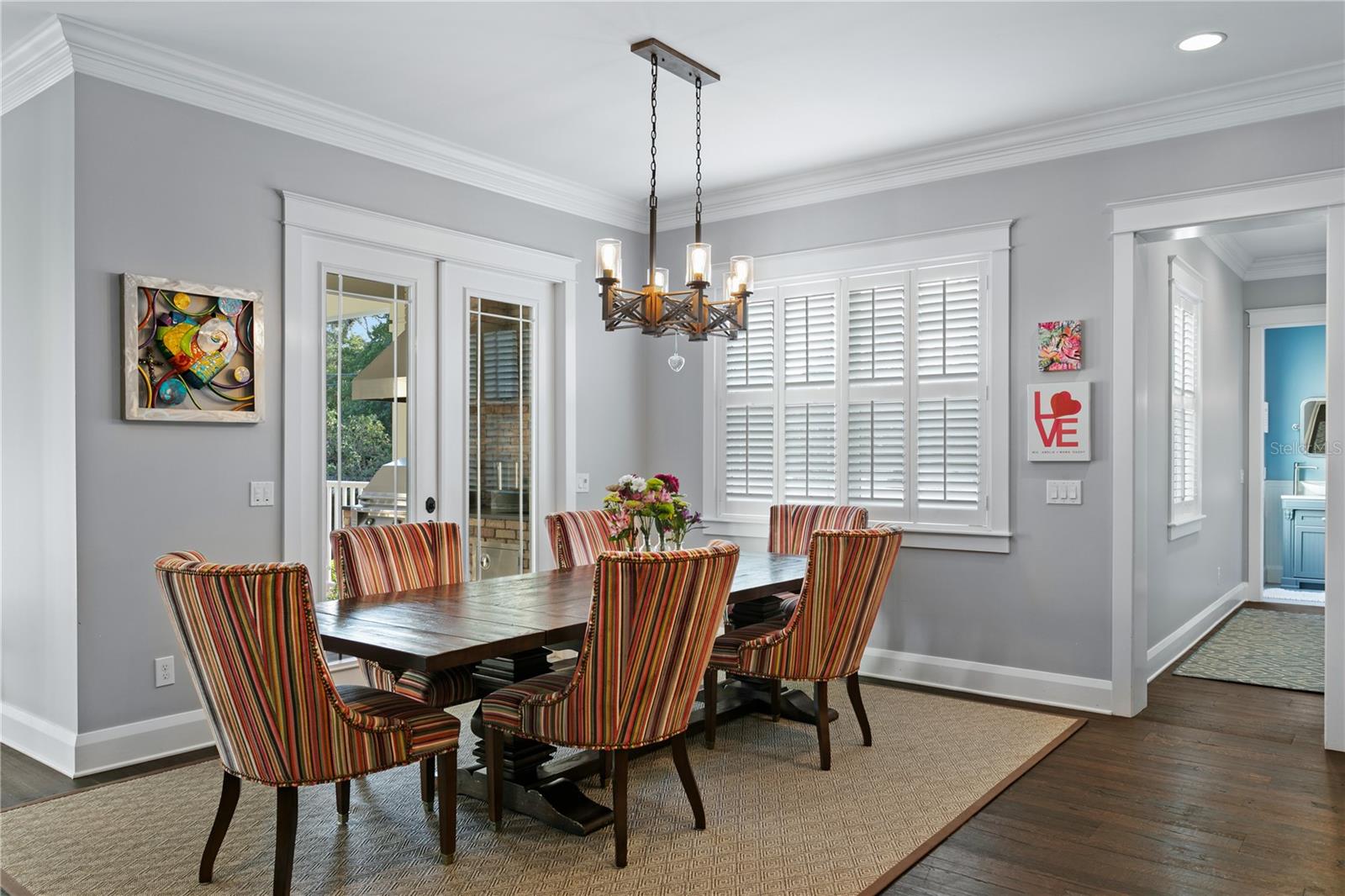 An extension of the kitchen is the perfect dining space with easy access to the covered lanai and outdoor cooking area.