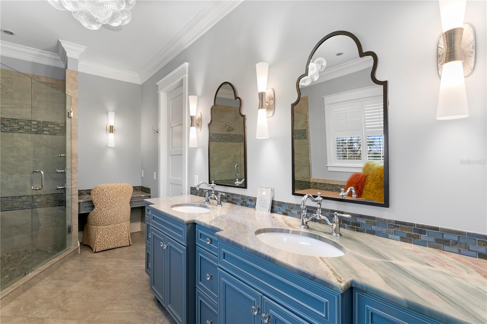 A luxurious master bathroom with oversized dual control walk-in shower, oversized tub, dual vanities with elevated fixtures