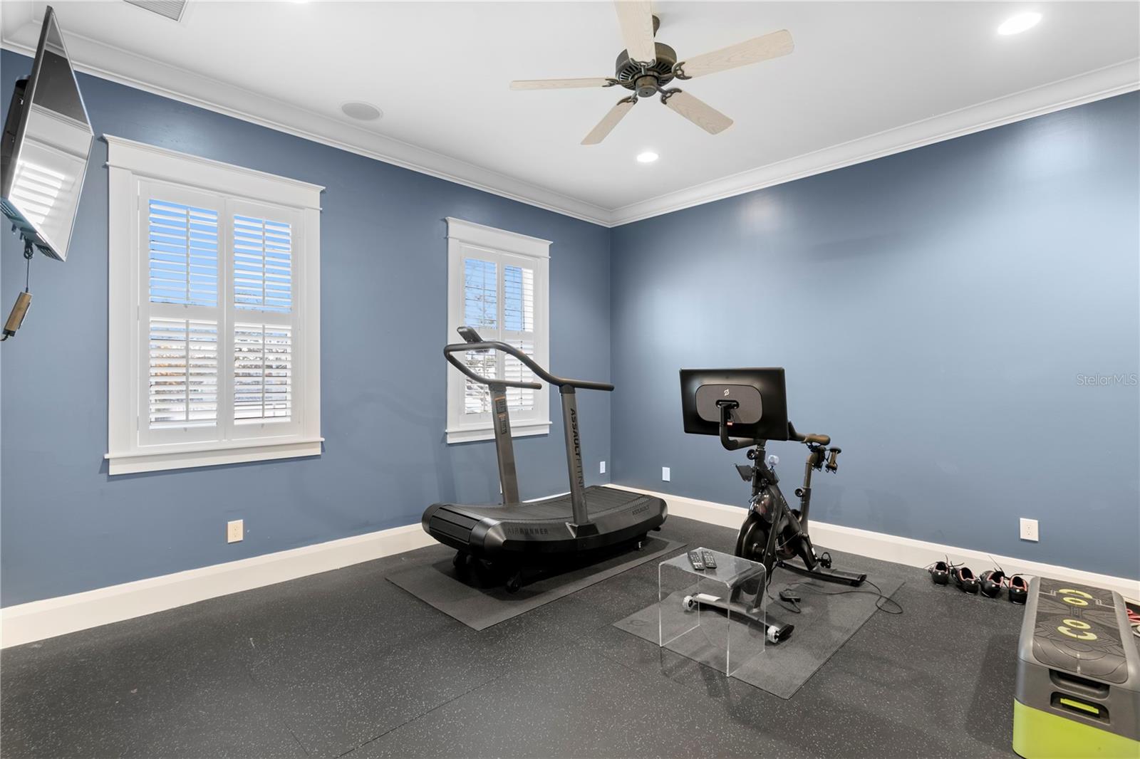 The secondary bedroom/fitness room