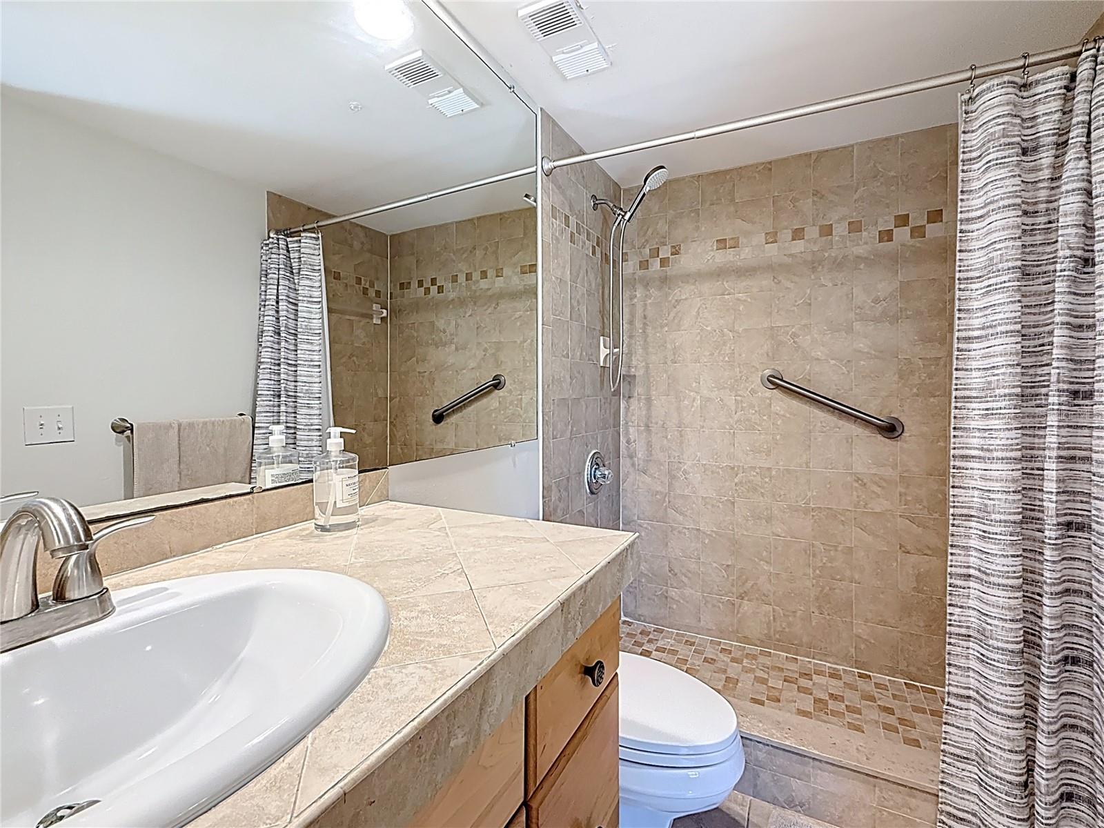 The ensuite bathroom has a walk-in shower while the 2nd bathroom has a soaking tub.