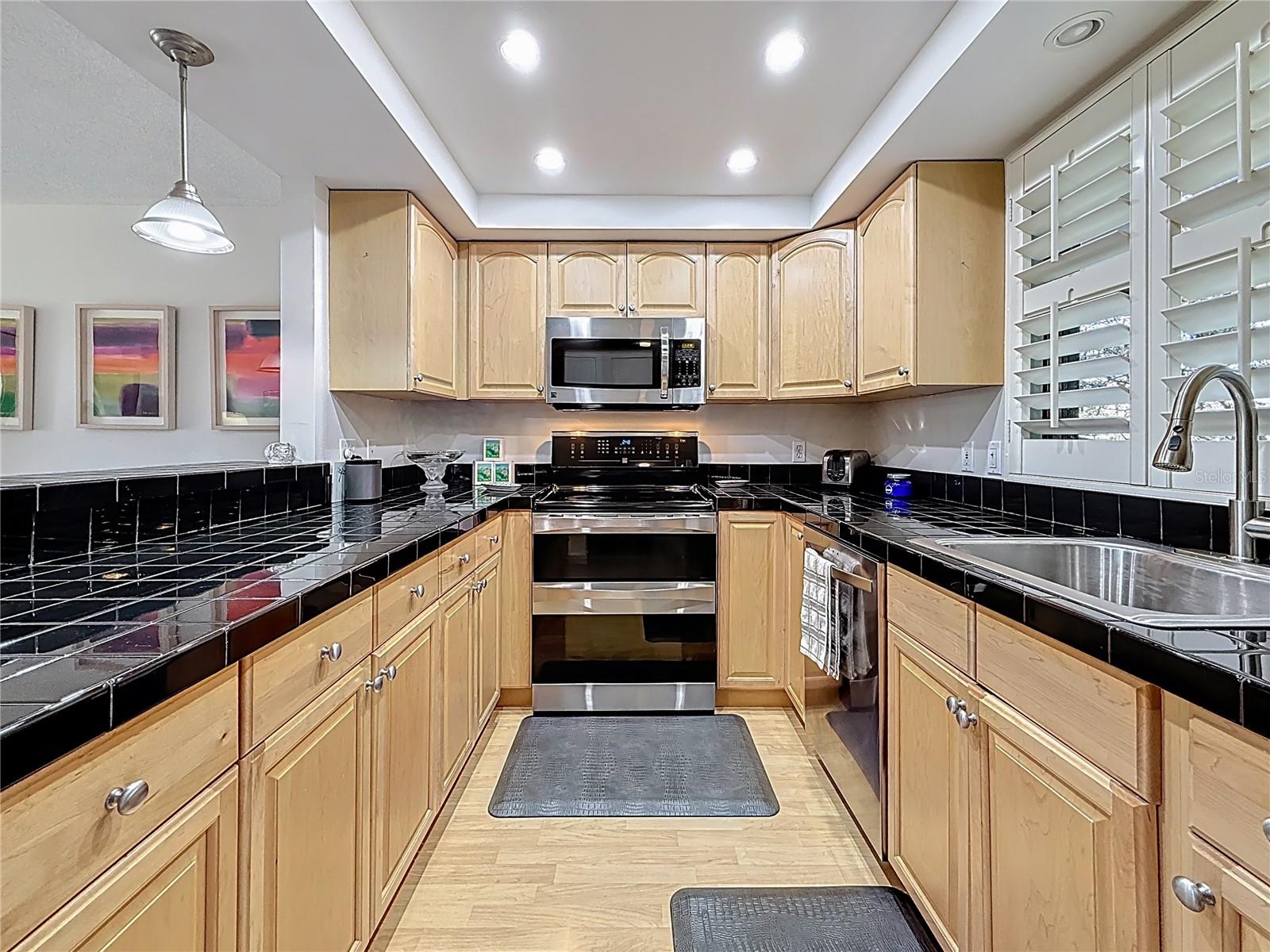 The galley kitchen opening into the dining area is perfect for cooking and entertaining.