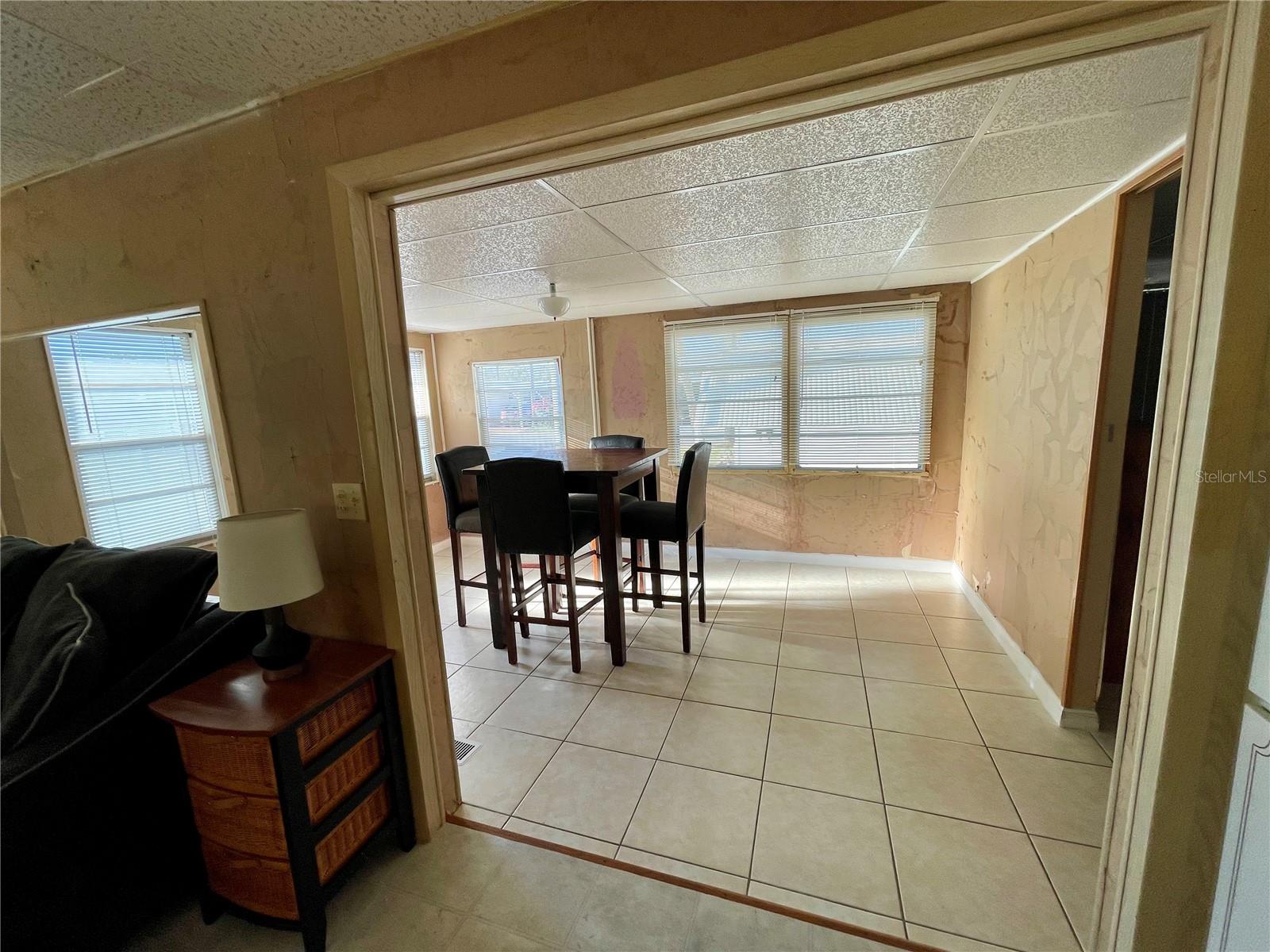 Looking in the Family room, lots of entertainment space, owner uses as a dining room, but could be anything! 2nd bedroom with NO closet is to the right of this room