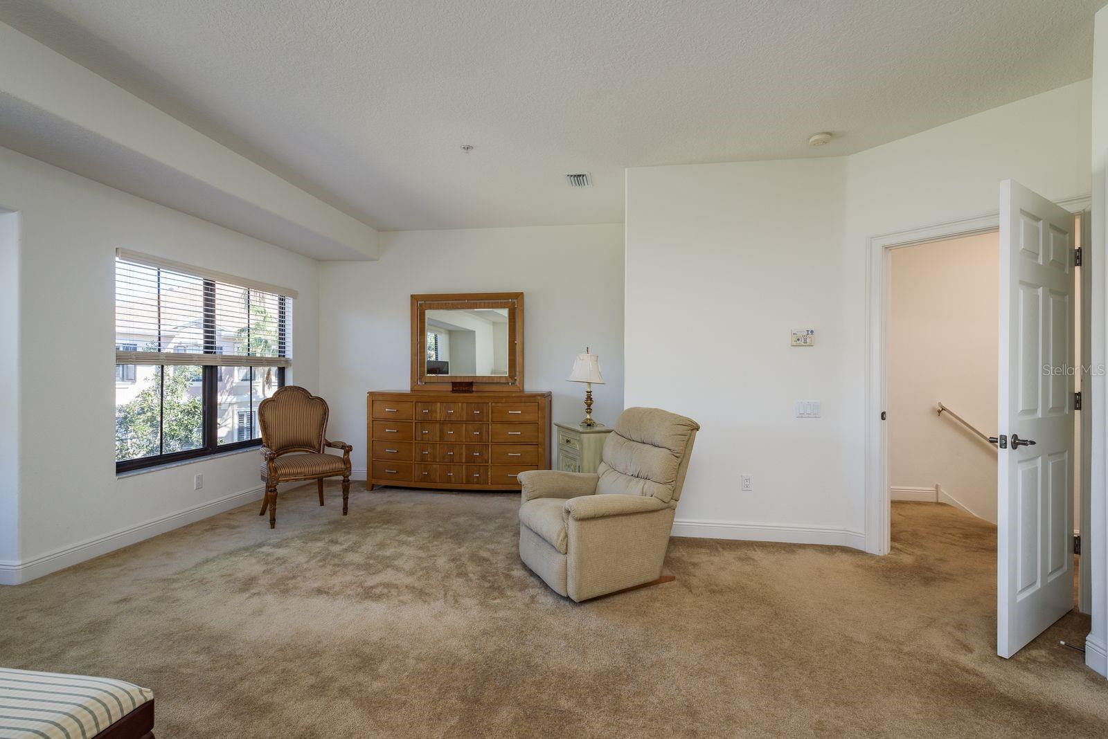 Primary Bedroom Sitting Area. Pond and lagoon views