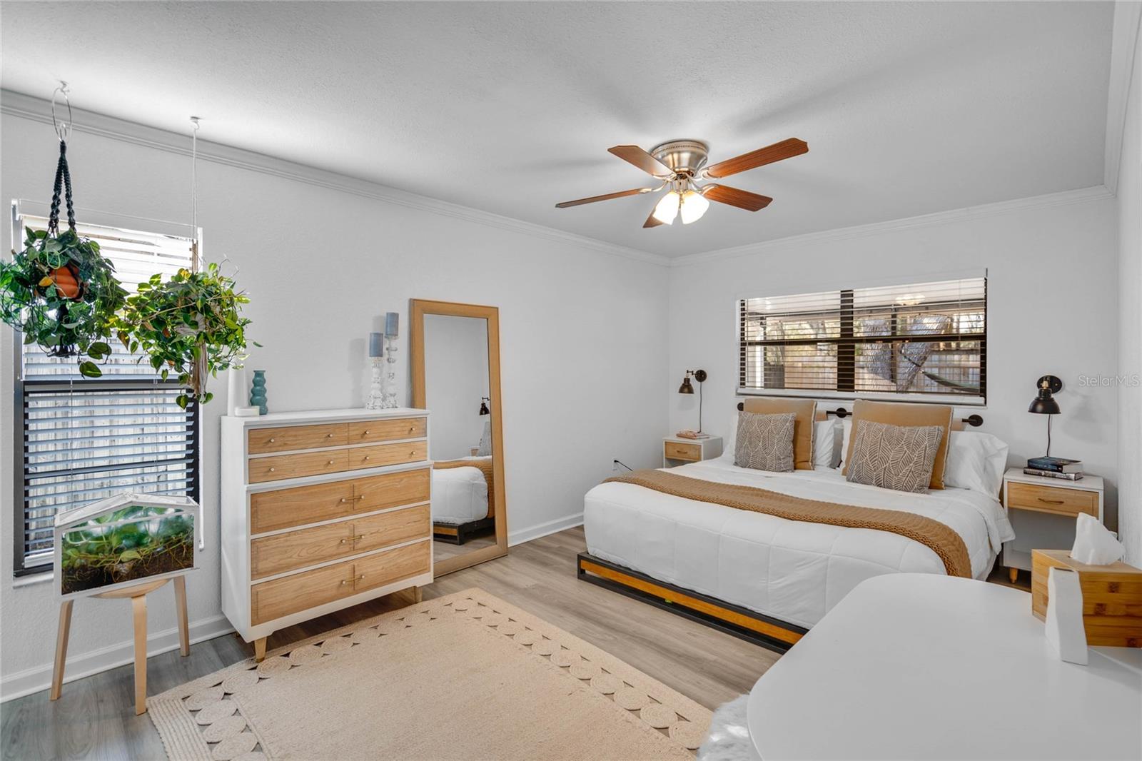 Spacious primary bedroom with new luxury vinyl plank flooring