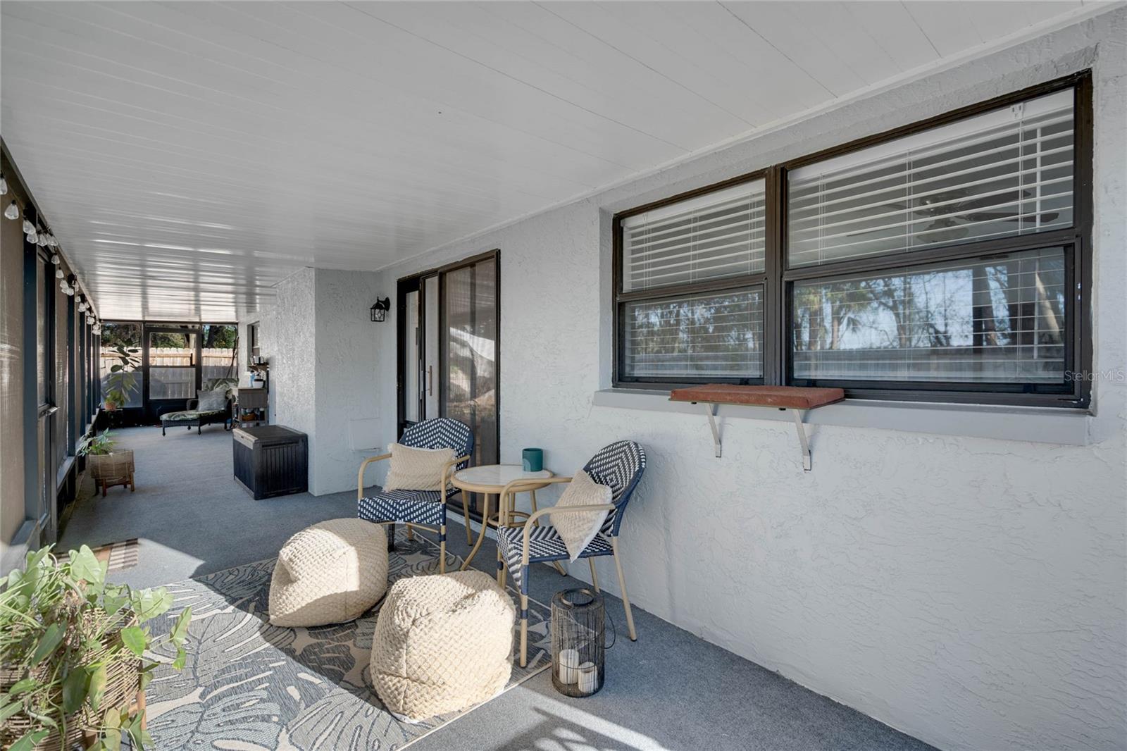 Massive covered & screened in back patio