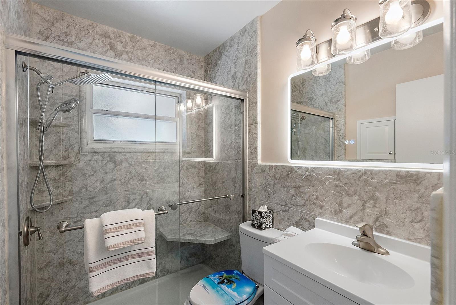 UPDATED MASTER BATHROOM - WALK-IN SHOWER WITH SMALL BENCH SEAT