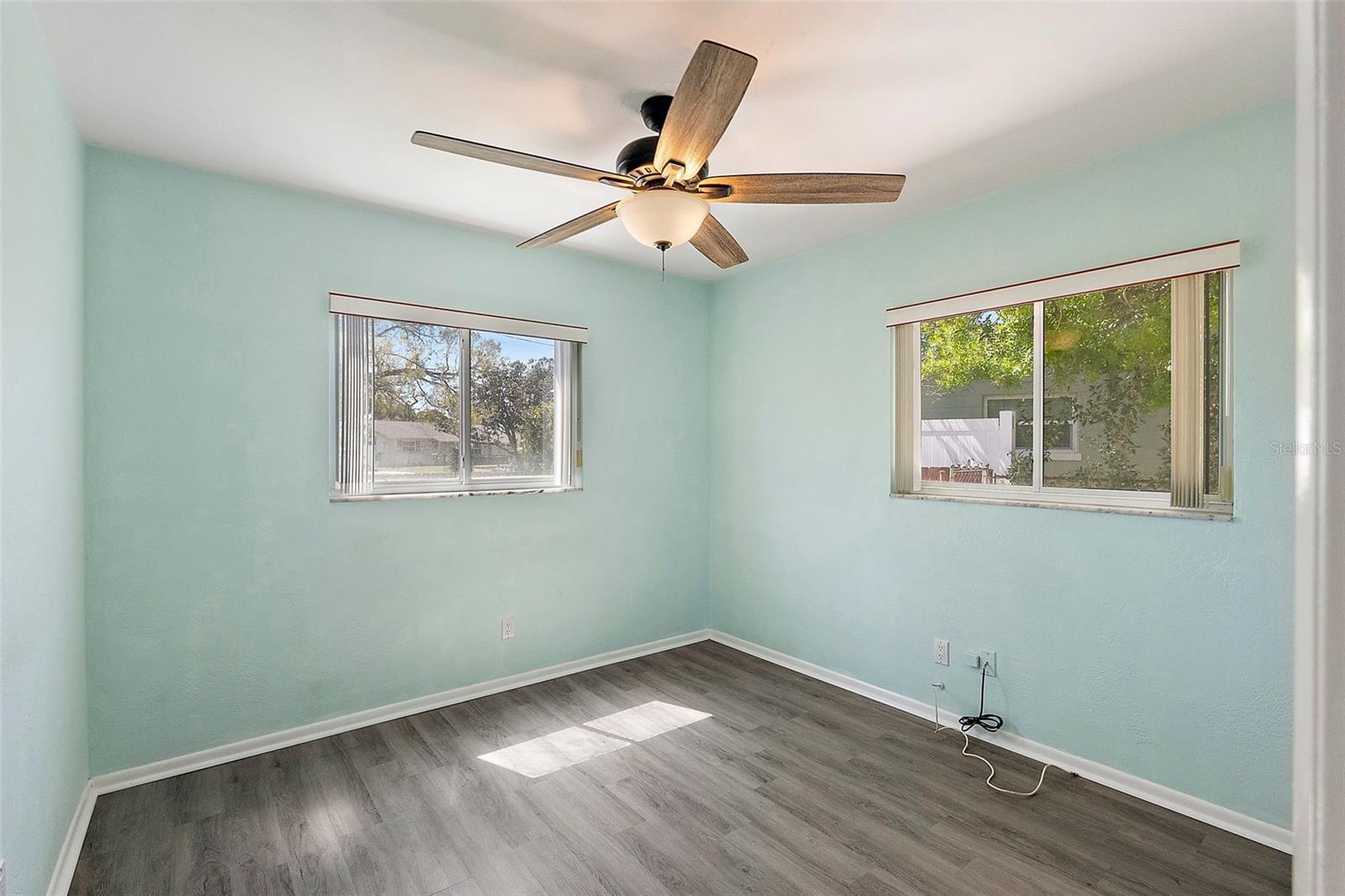 2ND BEDROOM WITH WINDOWS FACING SIDE AND BACK YARDS