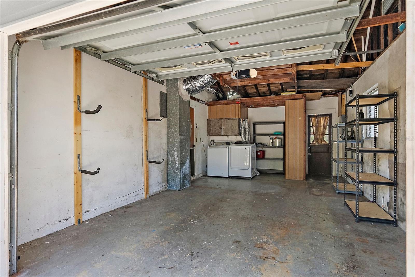 ONE CAR GARAGE - NEW WASHER AND DRYER/AIR HANDLER AND GENIE GARAGE DOOR MOTOR. PLENTY OF STORAGE ON THE GROUND AND ABOVE THE DOOR