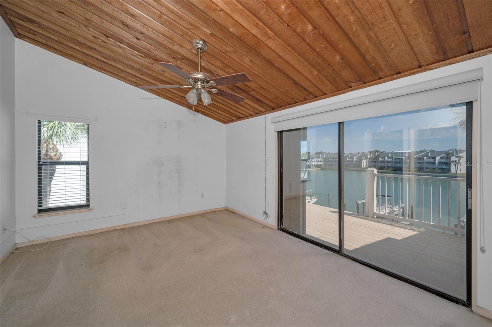 Primary bedroom with balcony