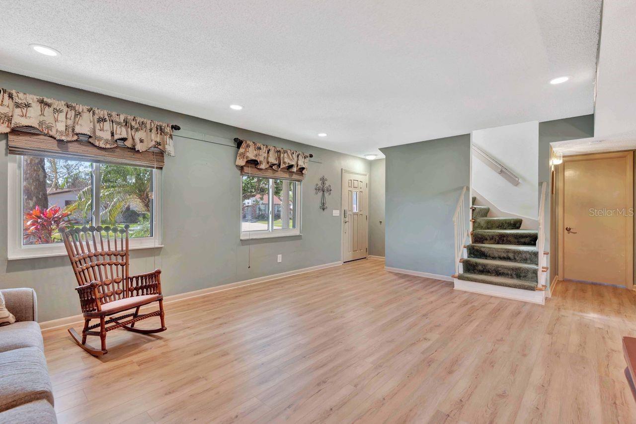 Staircase leads from formal living room.