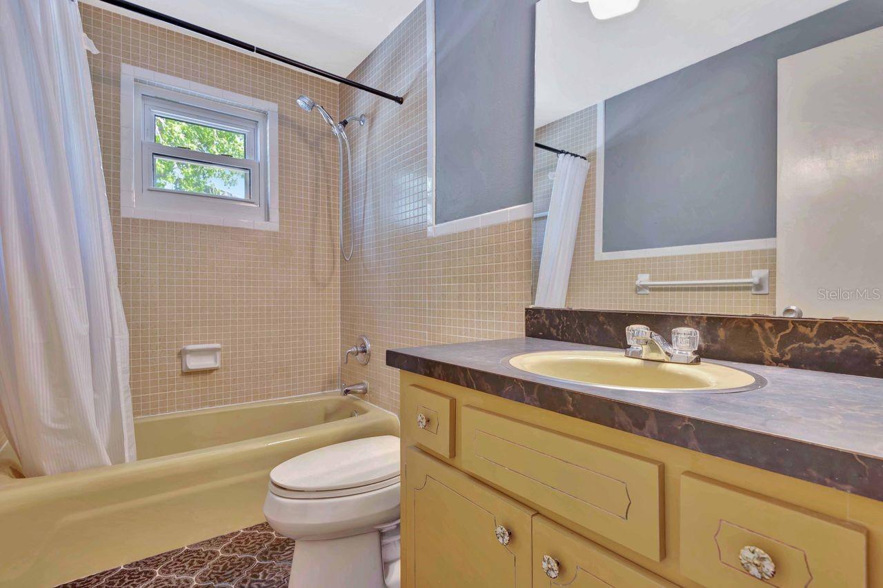 Upstairs bath serves three bedrooms.