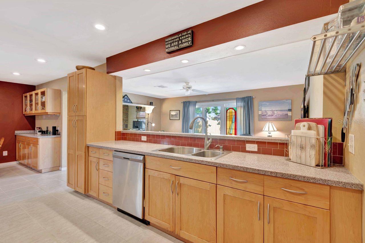 The kitchen is open and overlooks the family room.