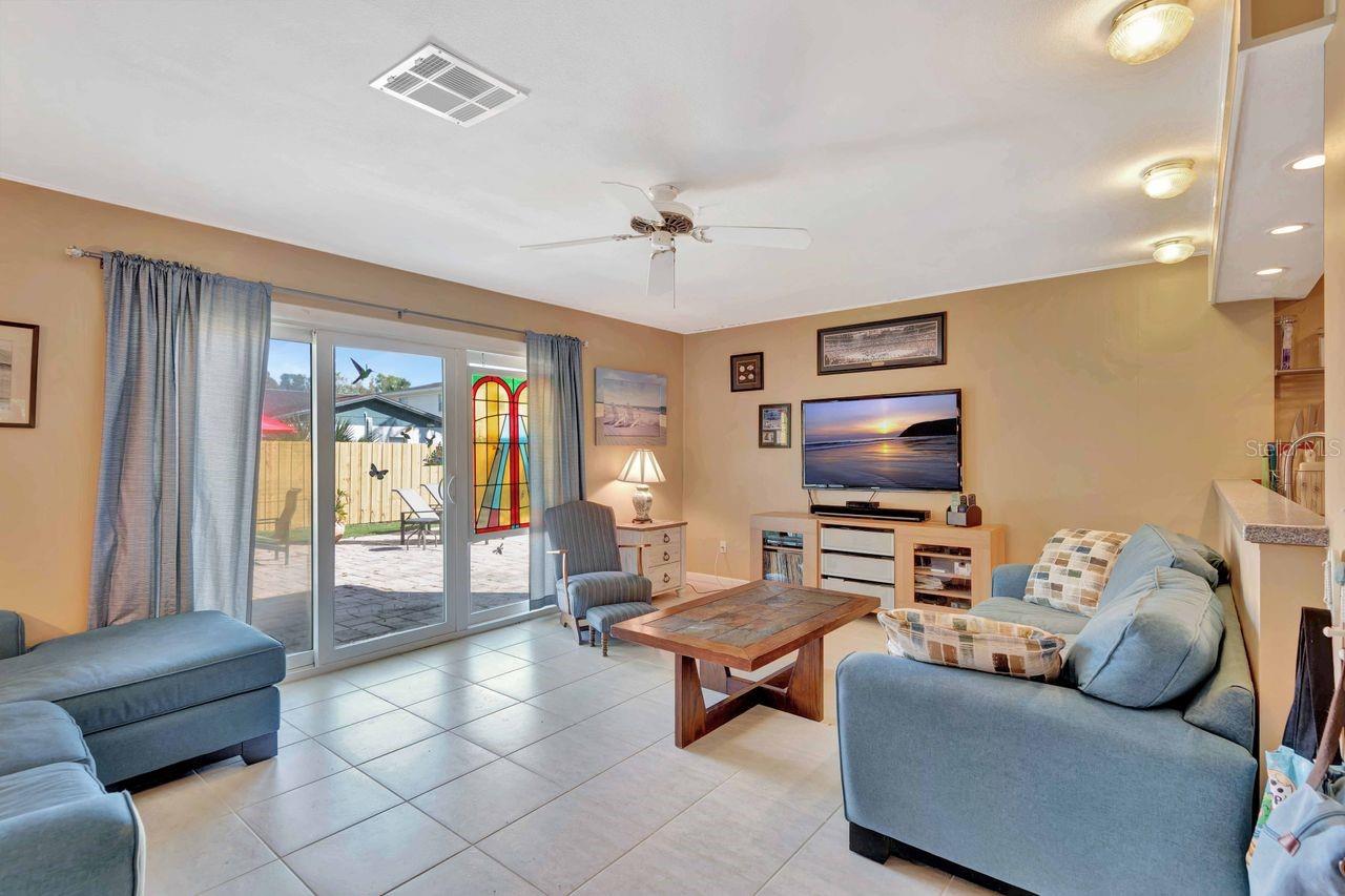 This large family room overlooks the pool and yard.