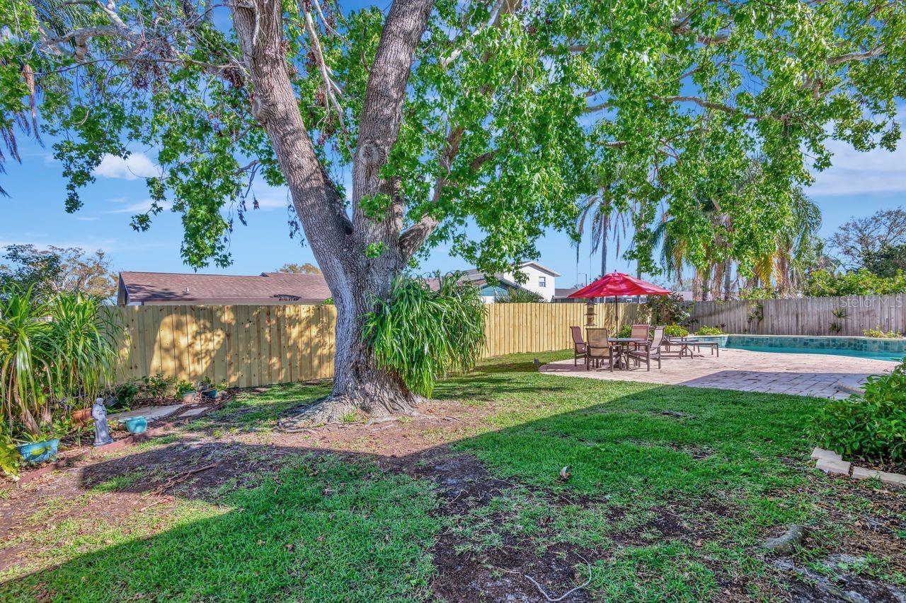 Large shady yard for pets or gardening.