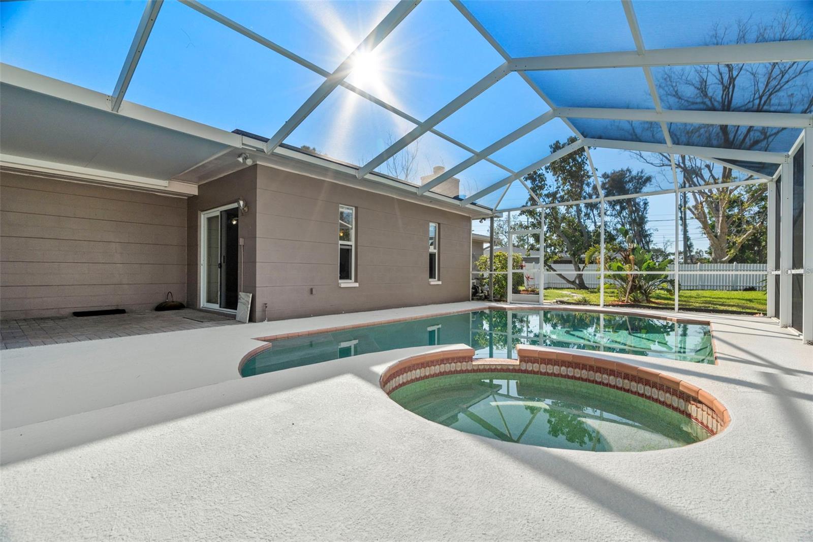 large enclosed bird cage over pool