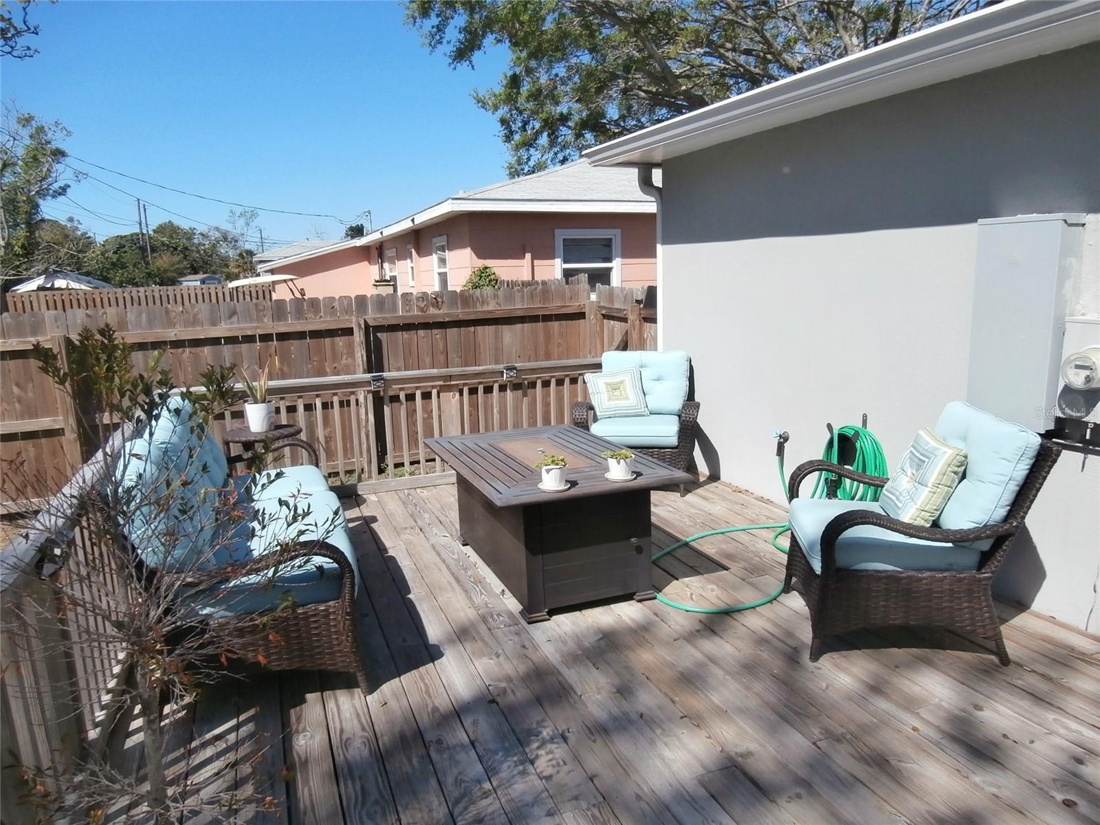 Back Patio with rail and stairs to back yard.