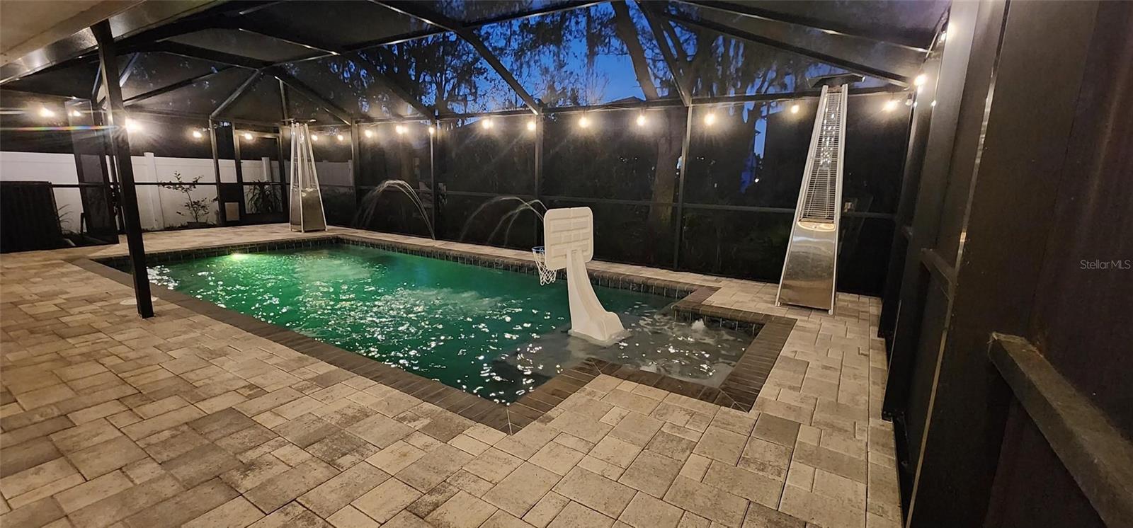 Nighttime photo with pool lights