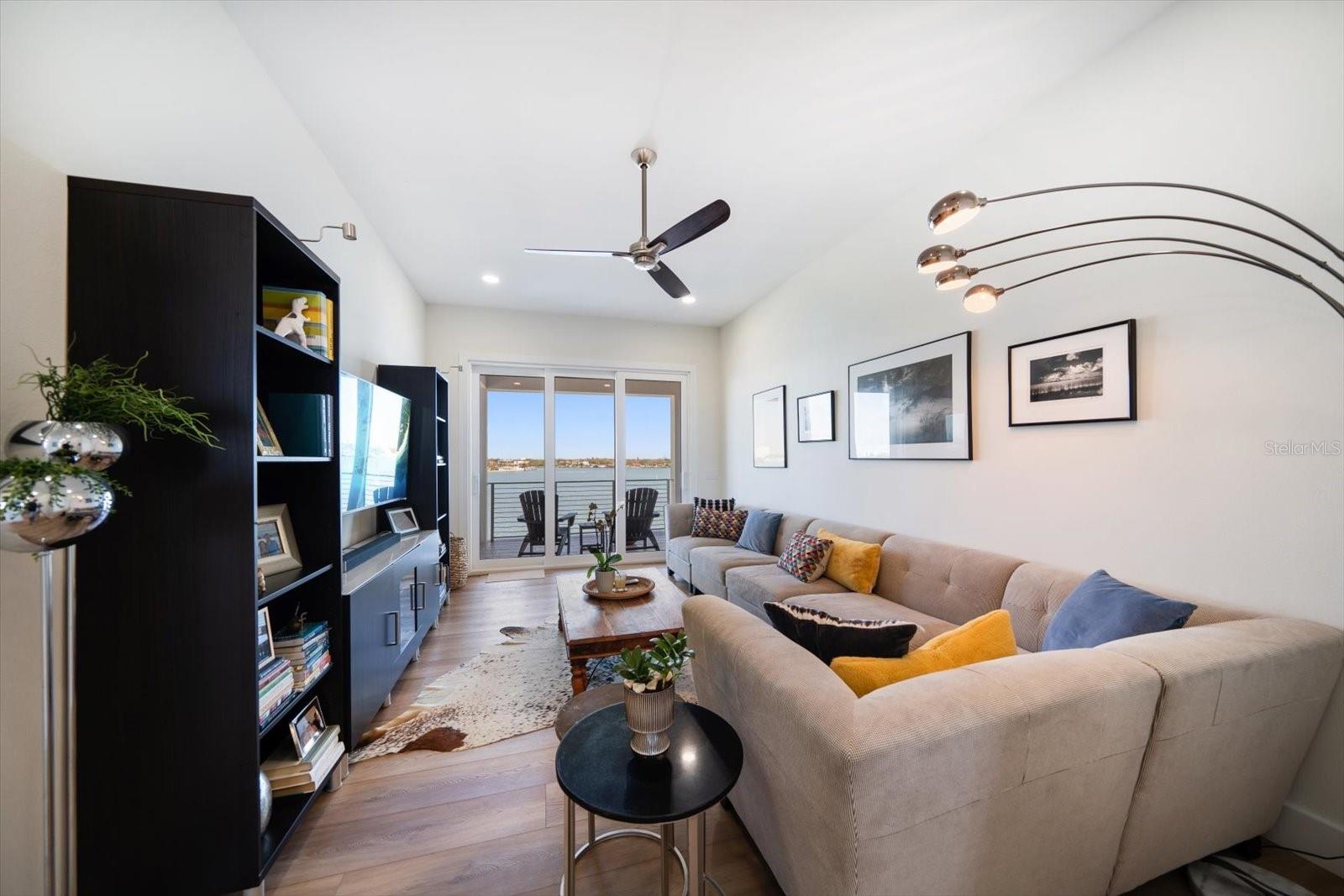 Family/Bonus/TV room upstairs with balcony on the bay