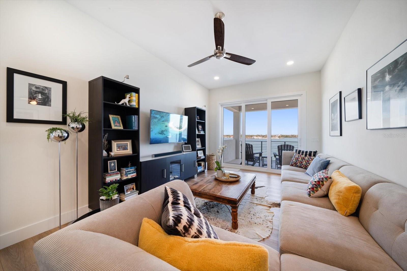 Family/Bonus/TV room upstairs with balcony on the bay