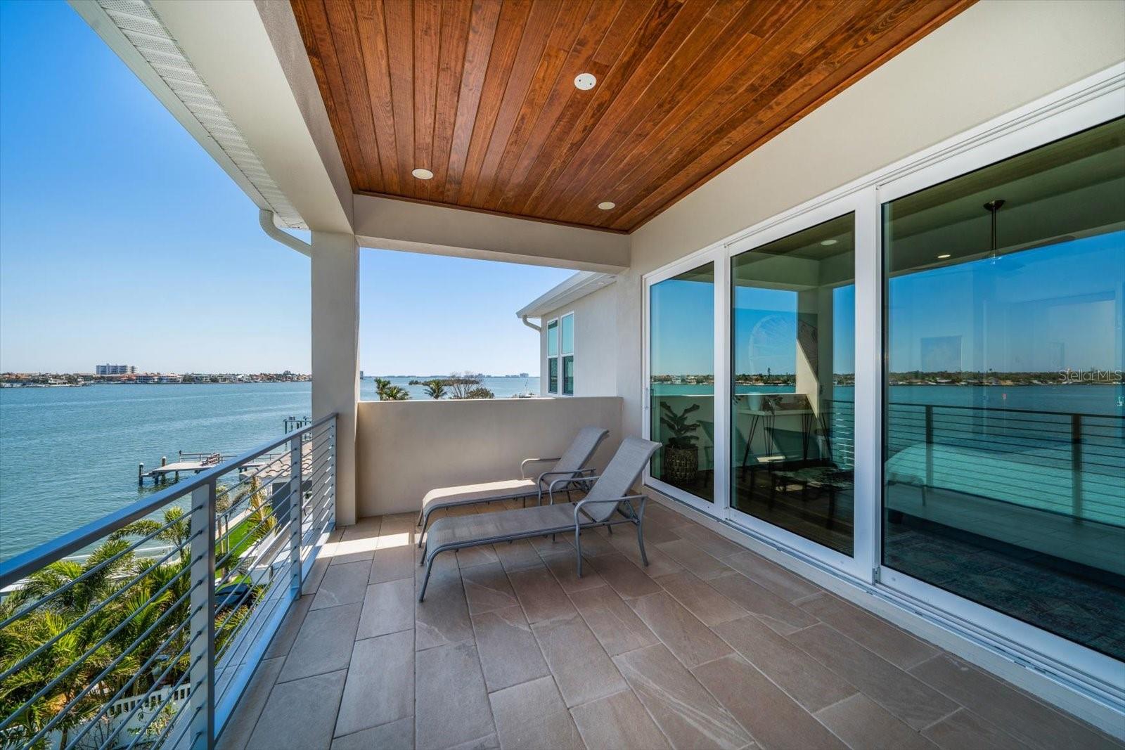 Primary Bedroom balcony, bring you coffee and watch the incredible sunrises.