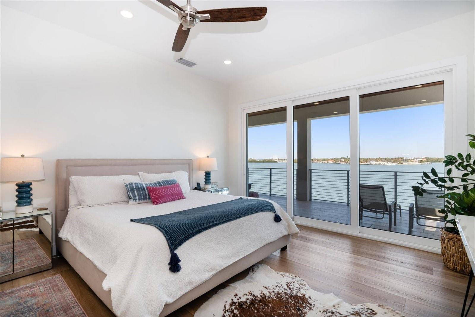 Primary Suite with balcony on the bay. Wake up to beautiful sunrise every morning!