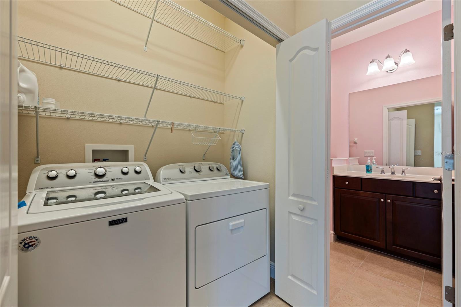 Inside laundry closet with gas dryer