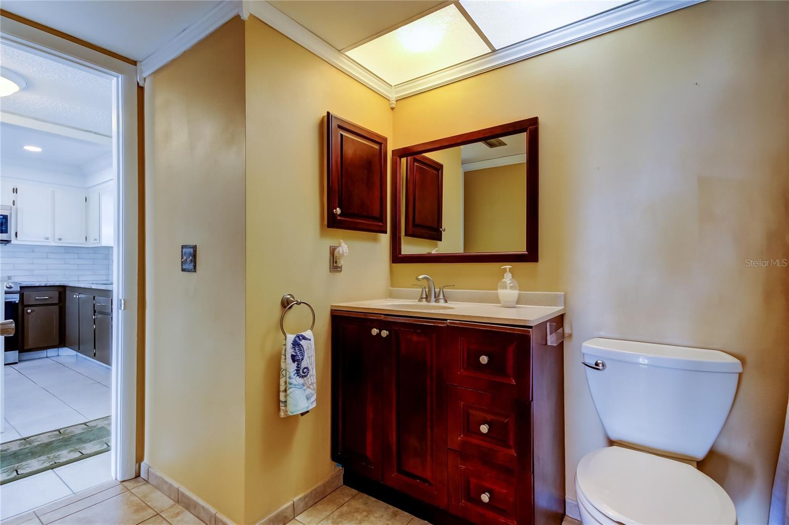 Bathroom showing door to Living Space