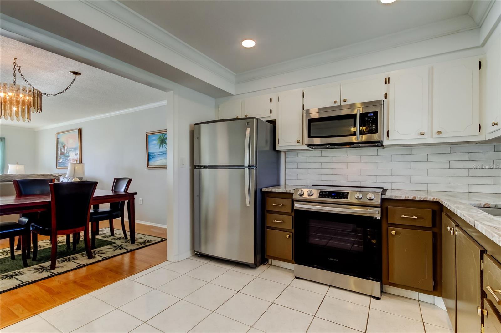 Stainless Steel Appliances, Granite Countertop, Pretty Tiled Backsplash and Ample Counterspace