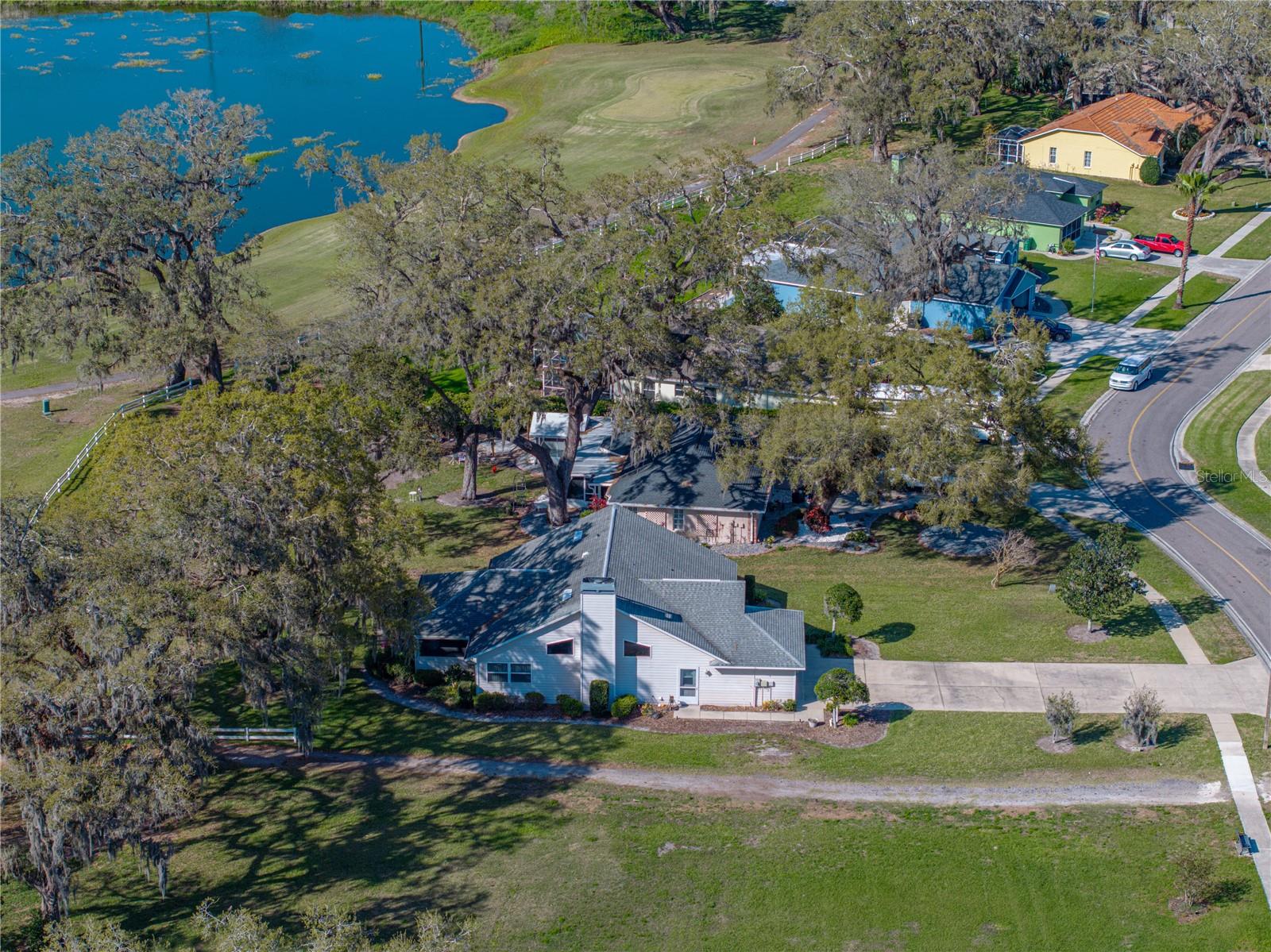 South side of home with pond in distance