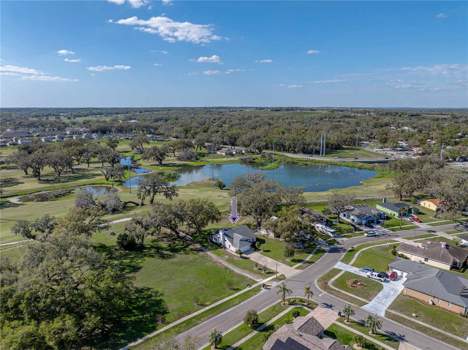 Home has view of golf course and pond