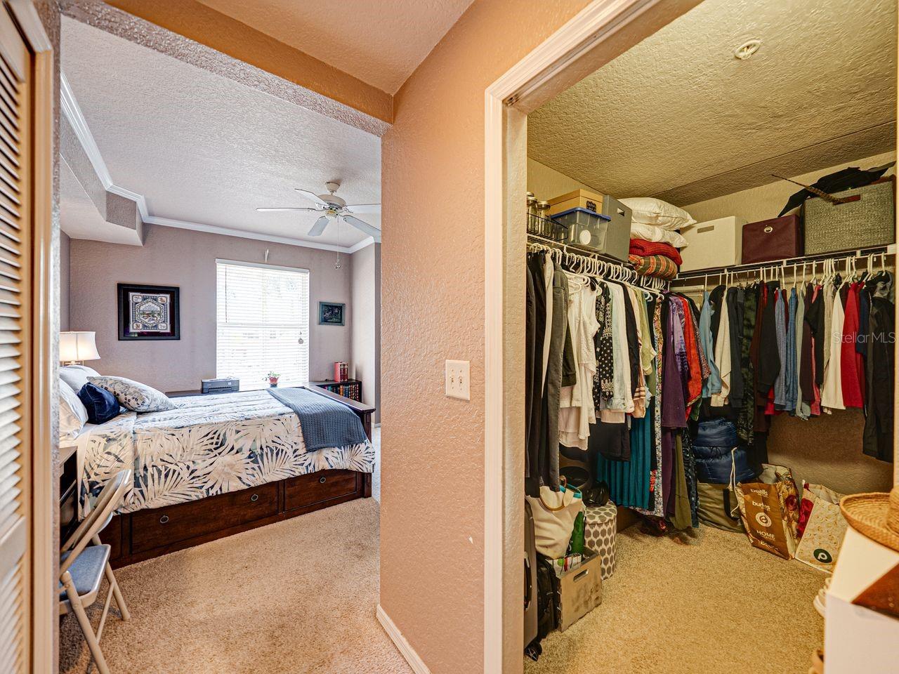 Large 8 x 6 walk-in closet in primary bedroom.