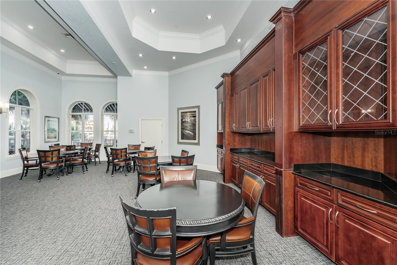 Common area with views of the pool and water.