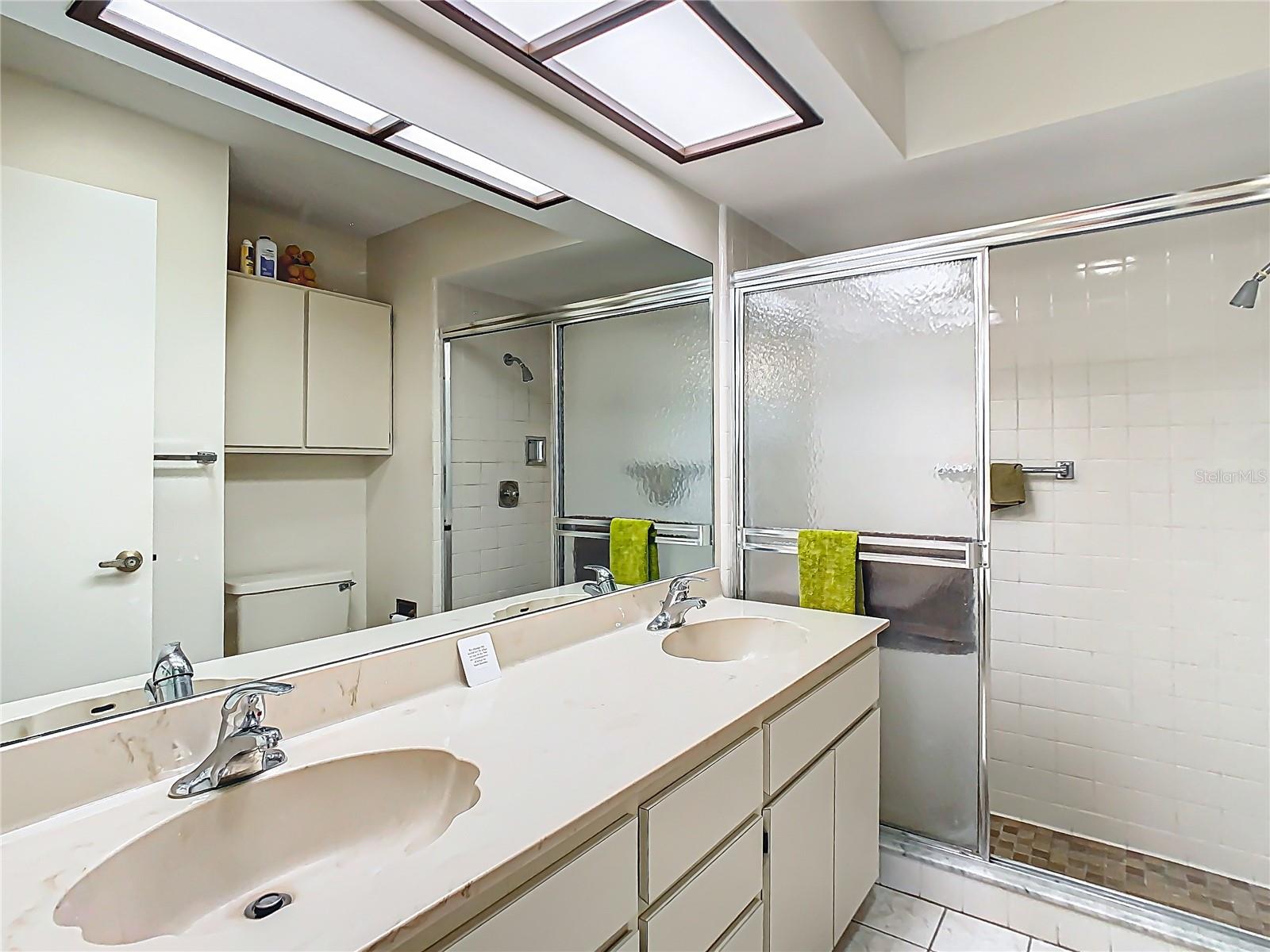 Primary Bathroom with dual sinks and walk-in shower