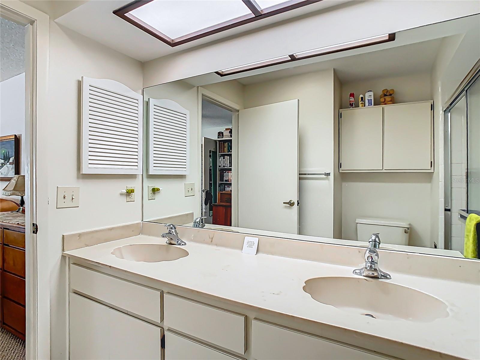 Primary Bathroom with dual sinks and walk-in shower